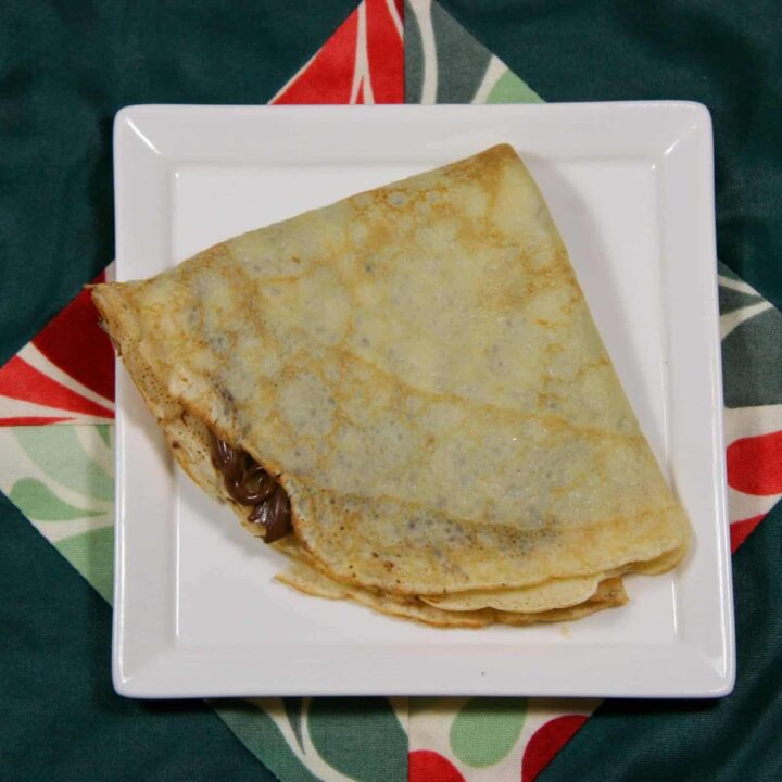 nutella crepe on a plate on a background