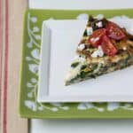 slice of spinach frittata with mushrooms and feta