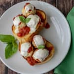chicken parmesan meatballs on white plate with green napkin