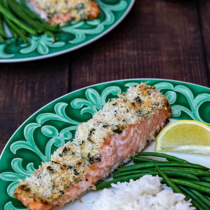 panko crusted salmon fillets with rice and green beans and lemon on green plates