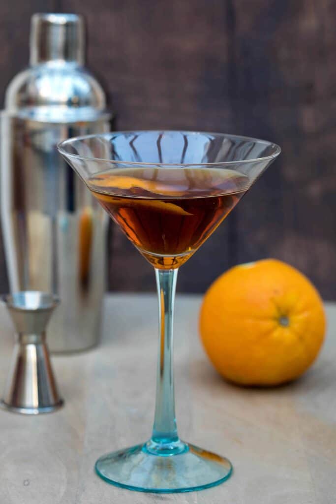 hanky panky cocktail with shaker and orange in background