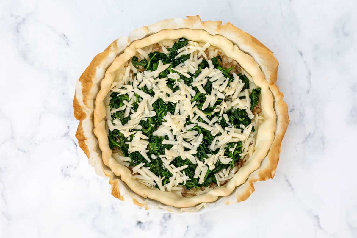 quiche crust filled with shallots, spinach, and cheese