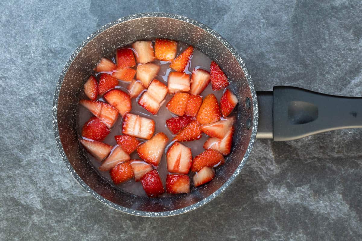 saucepan of chopped strawberries, sugar, and water