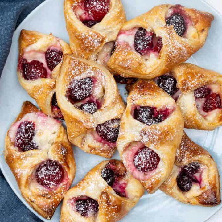 plate of cherry danishes with puff pastry