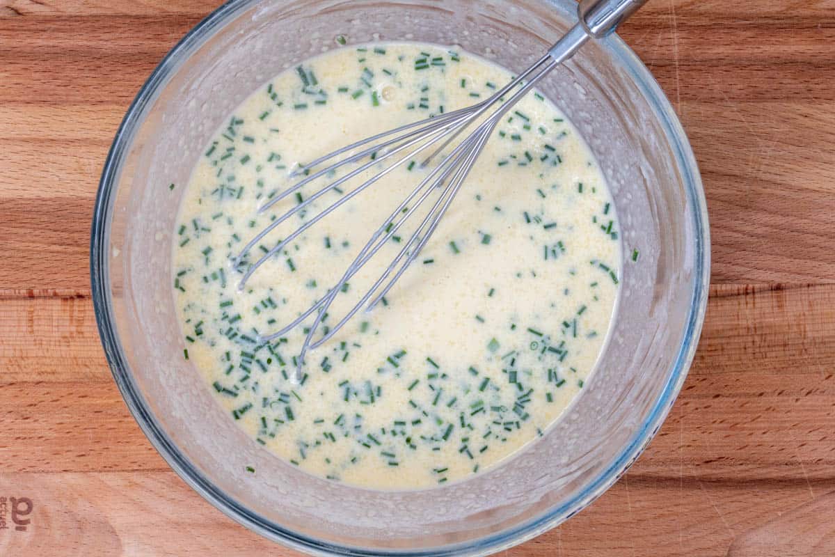 bowl of crepe batter with chives