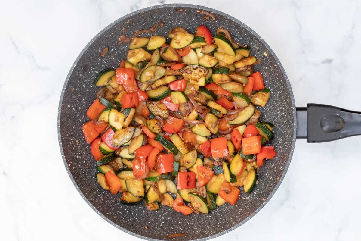 sautéed red onion, garlic, ginger, red bell pepper, and zucchini in large nonstick skillet