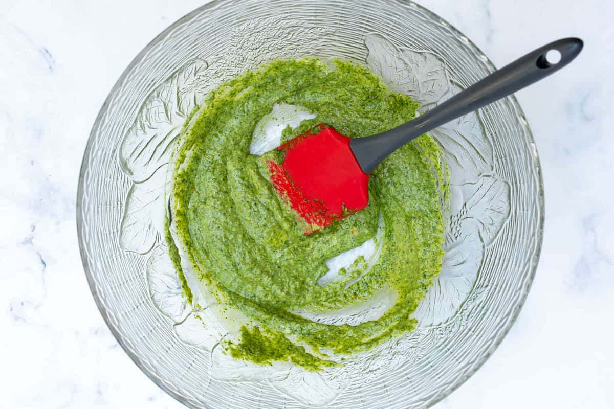 pesto and mayonnaise mixed together in large bowl