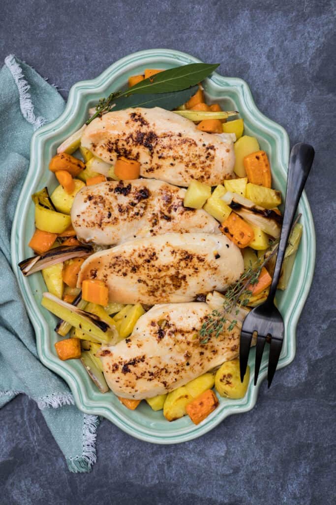 large platter of sheet pan roasted chicken and vegetables
