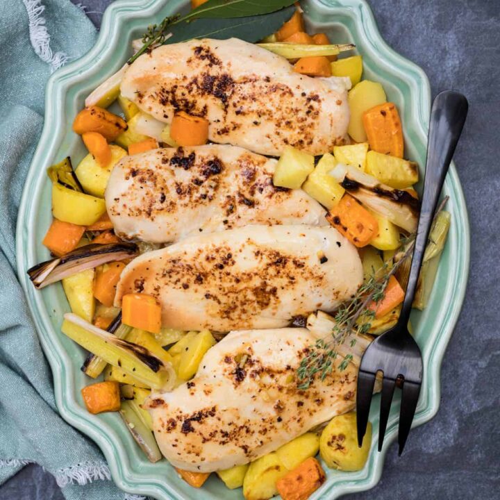 sheet pan roasted chicken on platter with fork and napkin