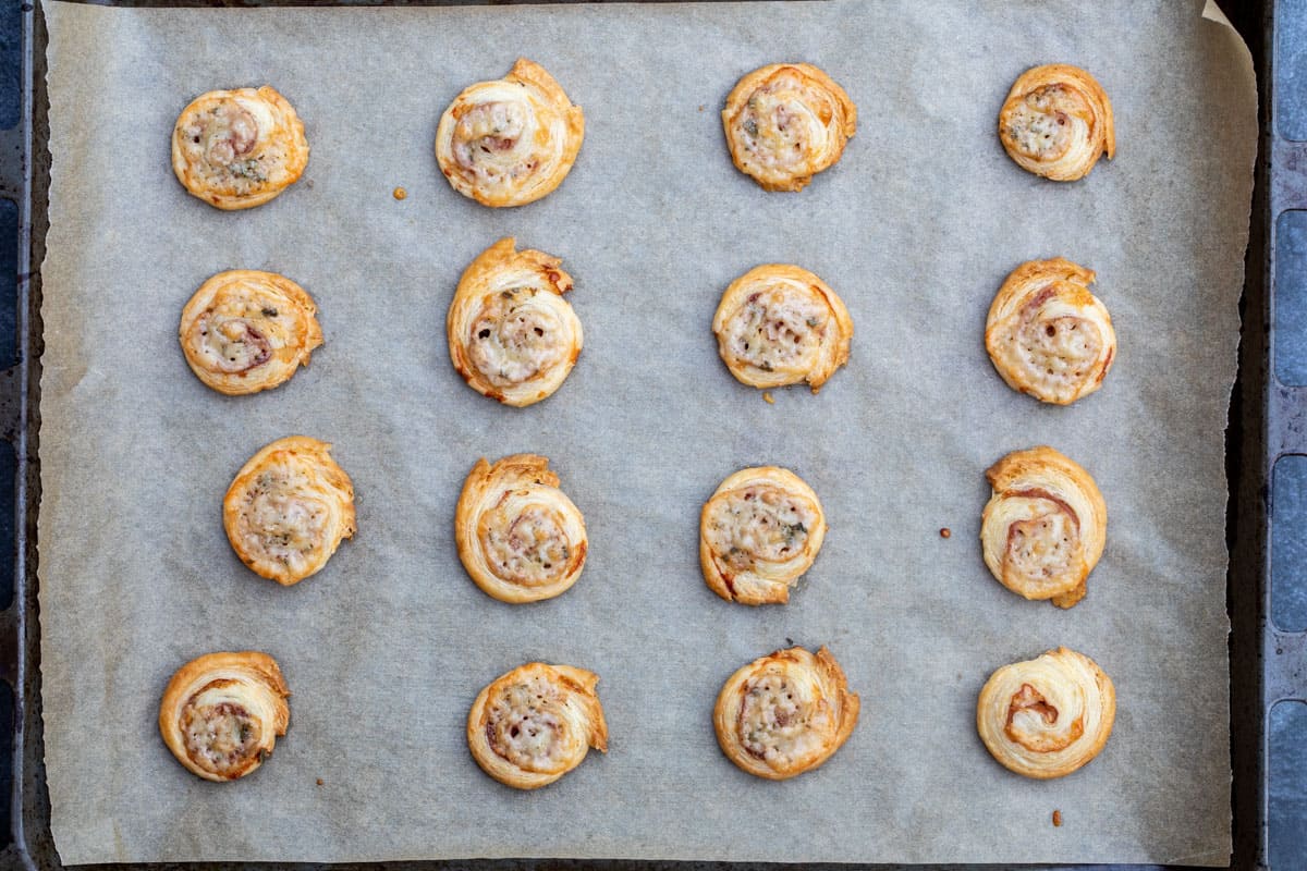 baked puff pastry pinwheels on baking sheet