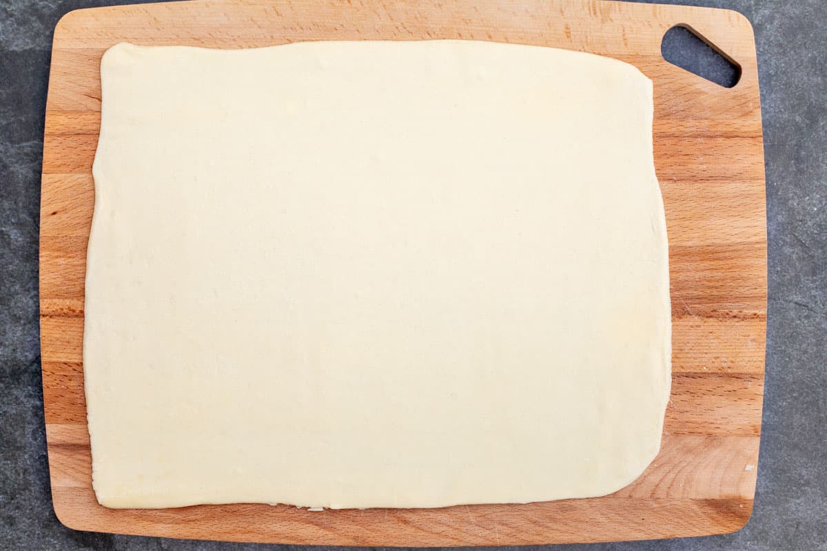 rolled out puff pastry dough on cutting board