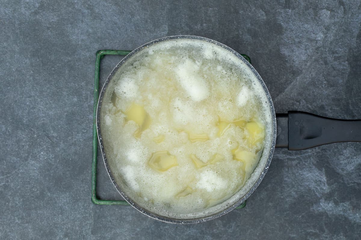 boiling potatoes in saucepan