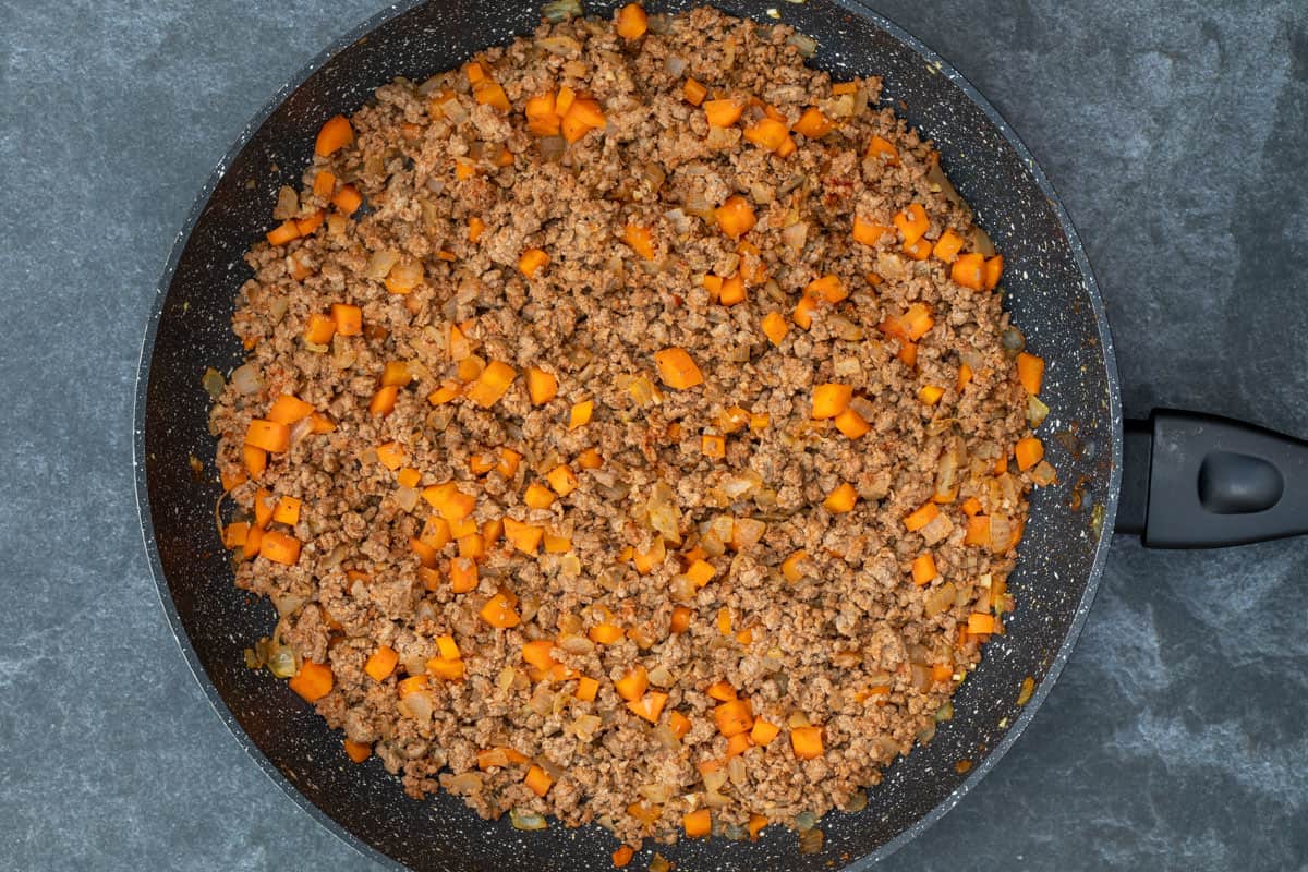 sautéed ground beef, carrots, onions, garlic in large skillet