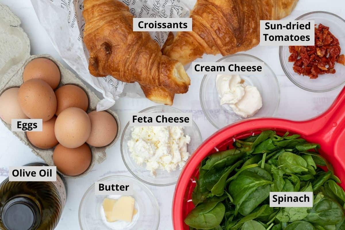 eggs, olive oil, feta cheese, butter, spinach, sun-dried tomatoes, croissants