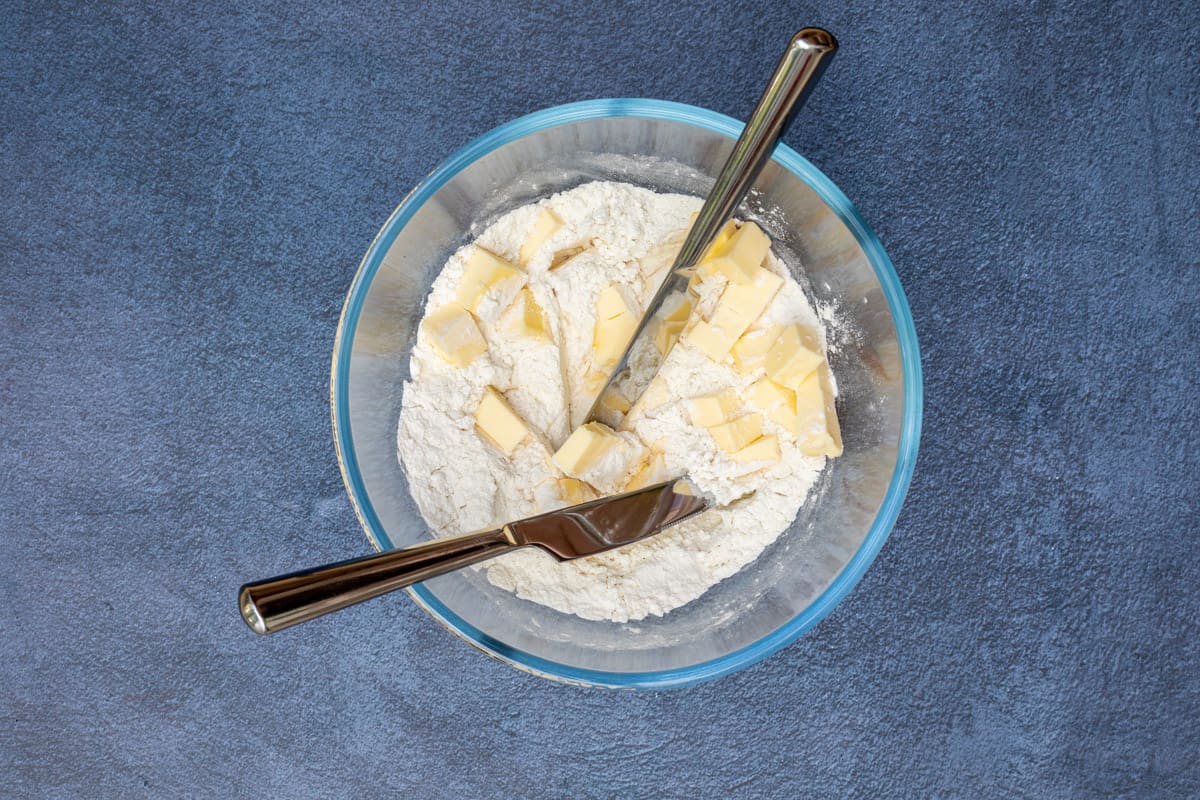 flour and butter in bowl with two knives