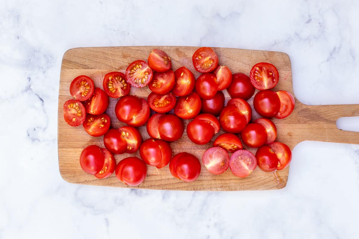 sliced tomatoes on cutting board