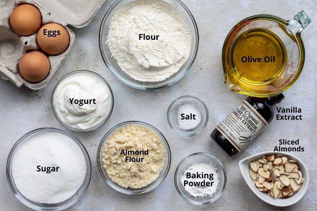 eggs, yogurt, flour, sugar, almond flour, salt, baking powder, olive oil, vanilla extract, and sliced almonds