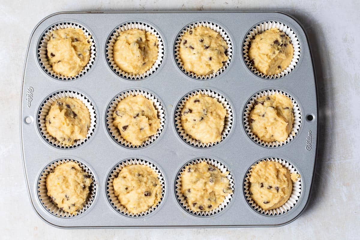 muffin tin filled with batter for almond flour banana muffins