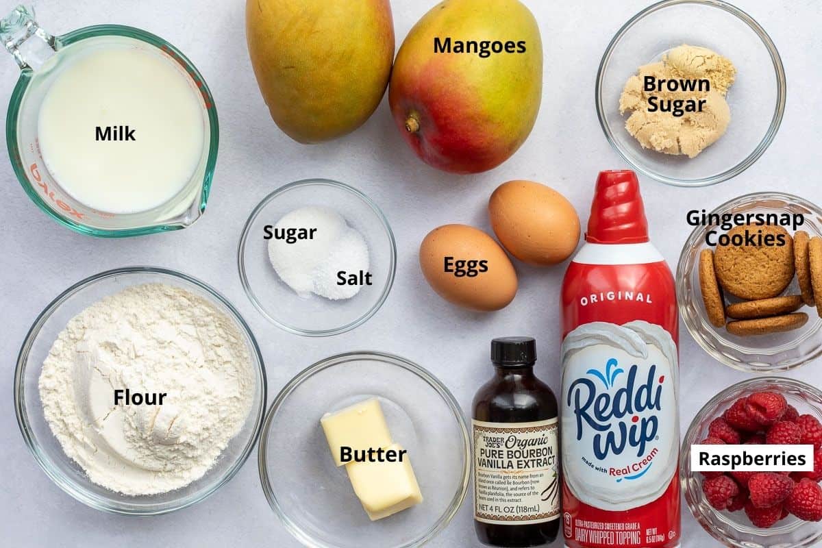 ingredients for mango crepes: milk, flour, sugar, salt, mangoes, eggs, brown sugar, gingersnap cookies, raspberries, whipped cream, and vanilla exrract