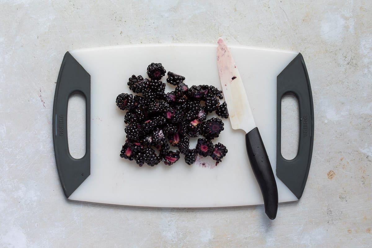 chopped blackberries on cutting board