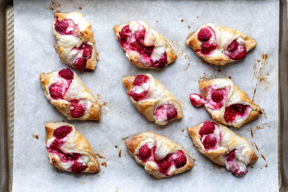 baked raspberry danishes on sheet pan