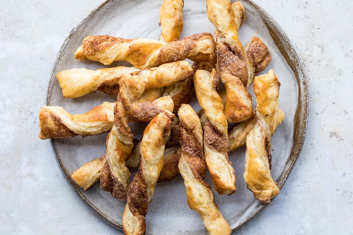 plate with pile of puff pastry cinnamon twists