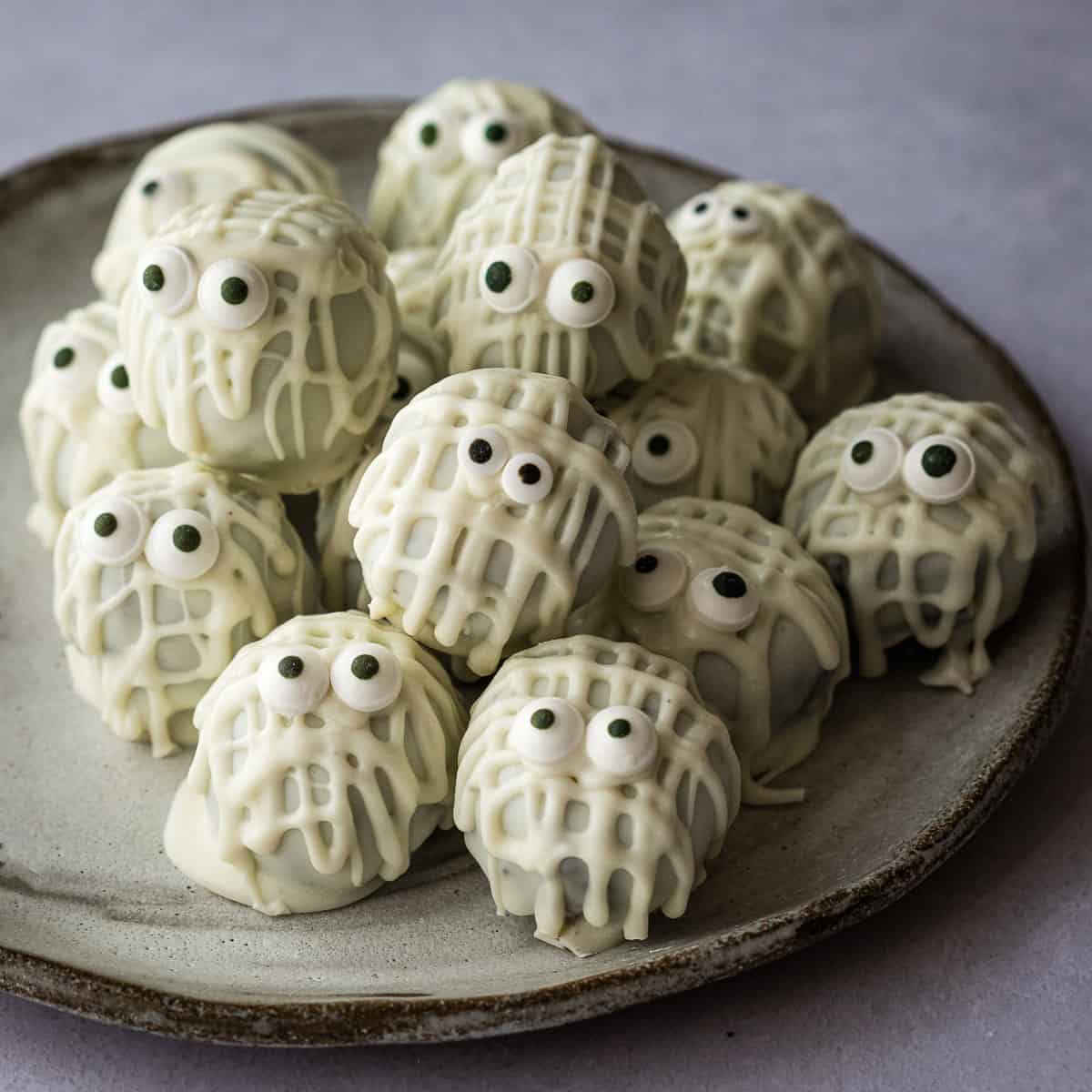 plate with stack of halloween Oreo truffles decorated as mummies