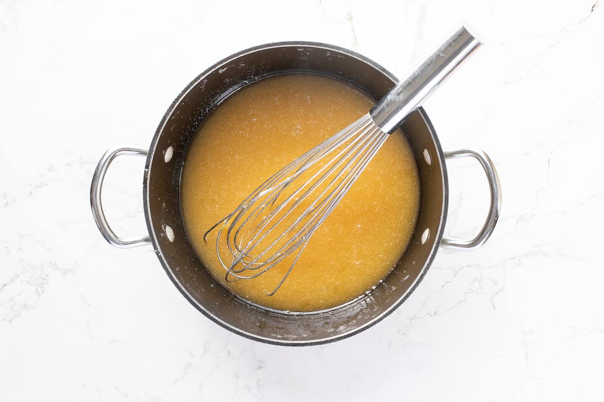 melted butter, sugar, eggs, vanilla, and lemon juice with whisk in saucepan