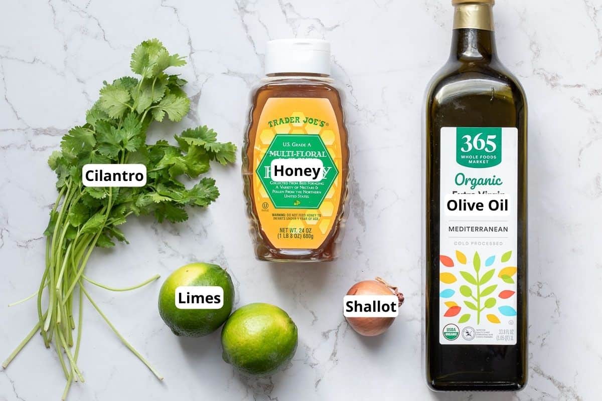cilantro, limes, honey, shallot, and bottle of olive oil.