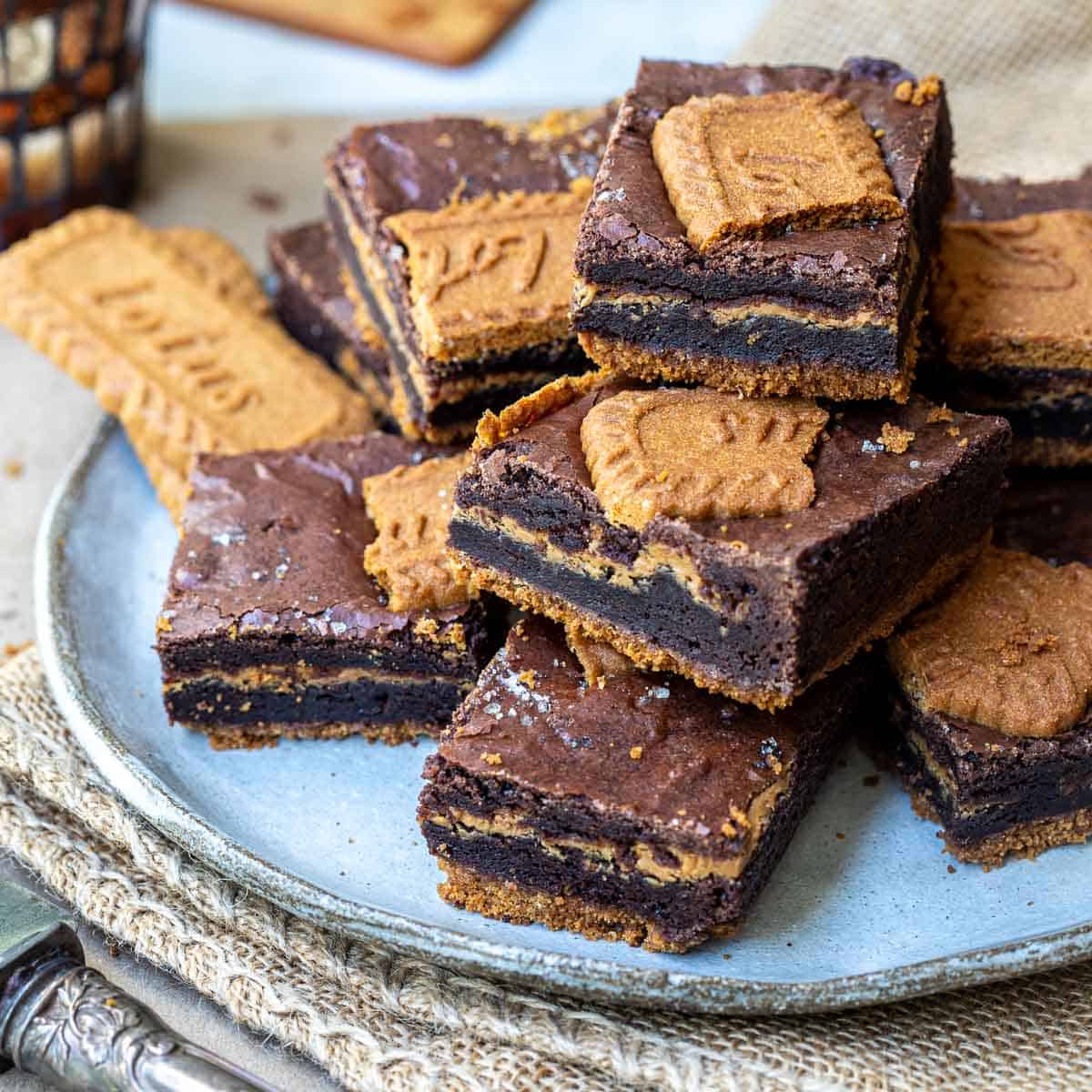 plate of stacked biscoff brownies.
