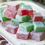 stacked red and green Christmas gumdrops on a platter.