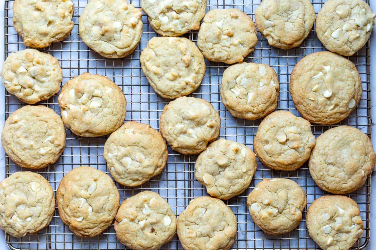 baked white chocolate macadamia nut cookies on cooling rack.