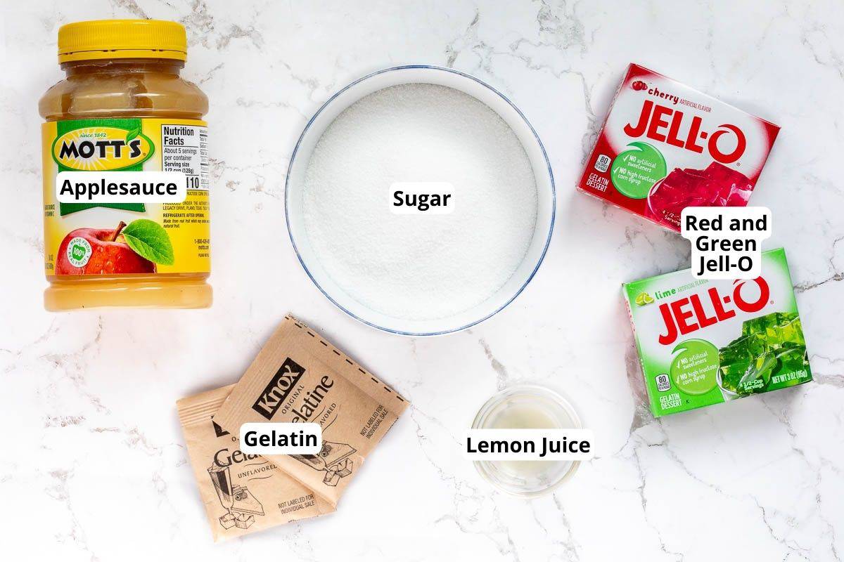 applesauce, bowl of sugar, gelatin packets, lemon juice, and two boxes of Jell-O.