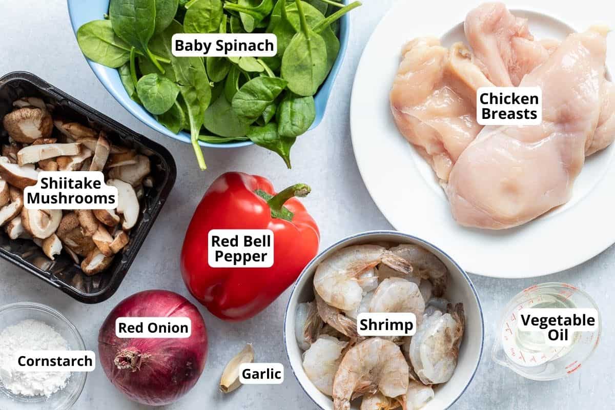 chicken breasts, baby spinach, shiitake mushrooms, red onion, red bell pepper, shrimp, garlic, cornstarch, and vegetable oil.