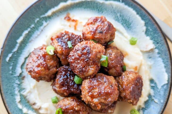 pile of BBQ pork meatballs on a plate.