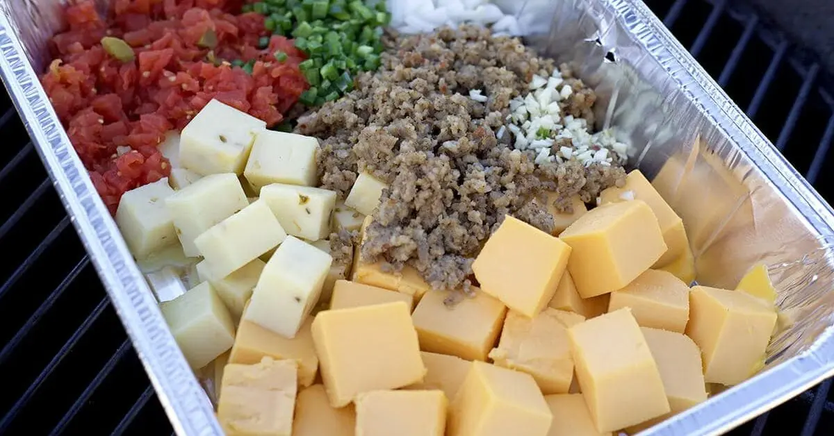 metal pan with ground beef, cheeses, Rotel, and onions.