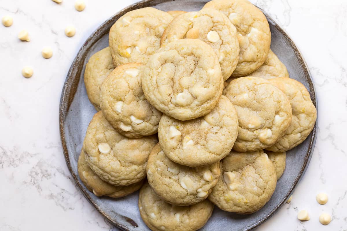 plate with white chocolate macadamia nut cookies.
