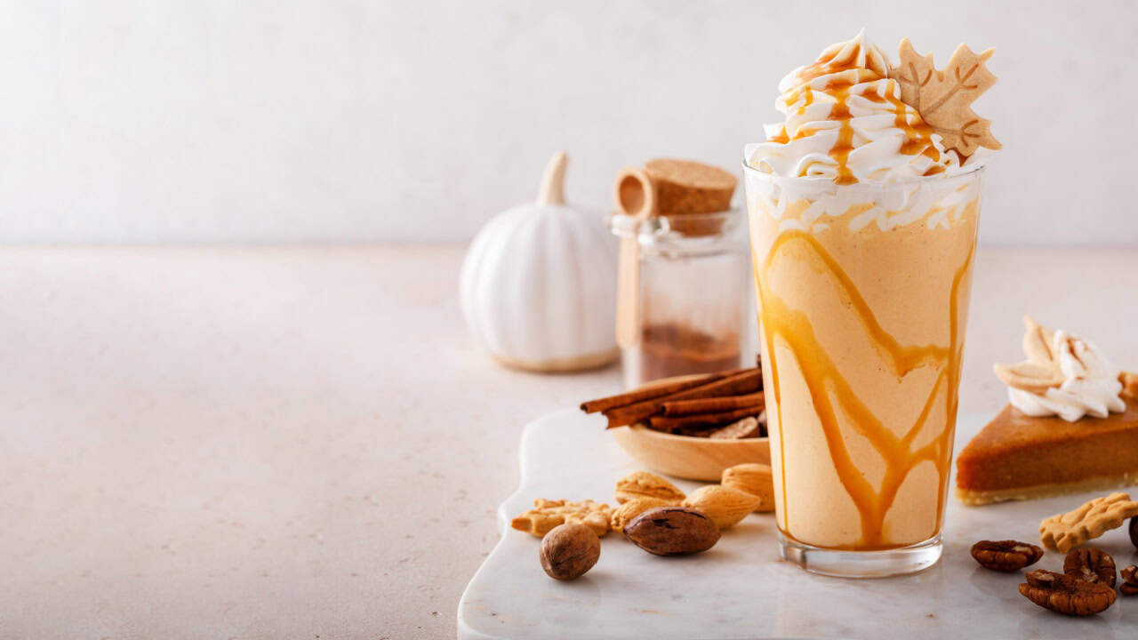 Pumpkin pie milkshake with caramel syrup and whipped cream on top