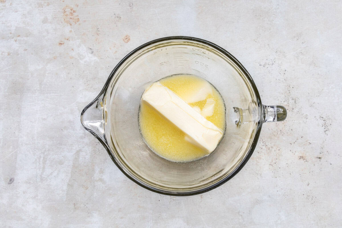 softened butter in glass mixing bowl.