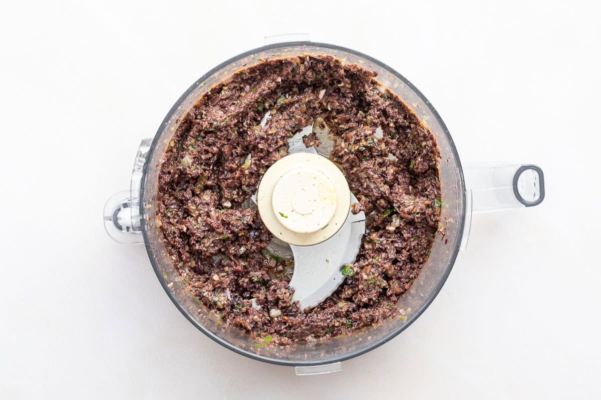 Olive tapenade in a food processor bowl.