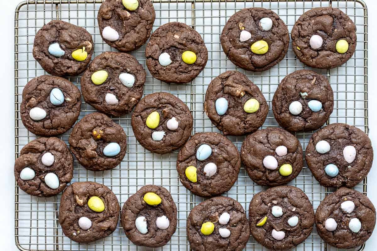 Mini Cadbury egg cookies on a cooling rack.