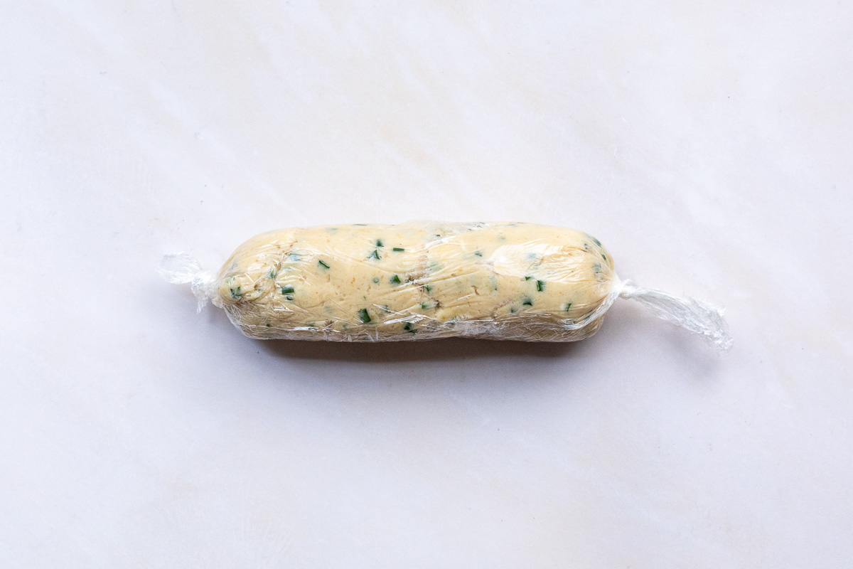 A log of miso butter wrapped in plastic.