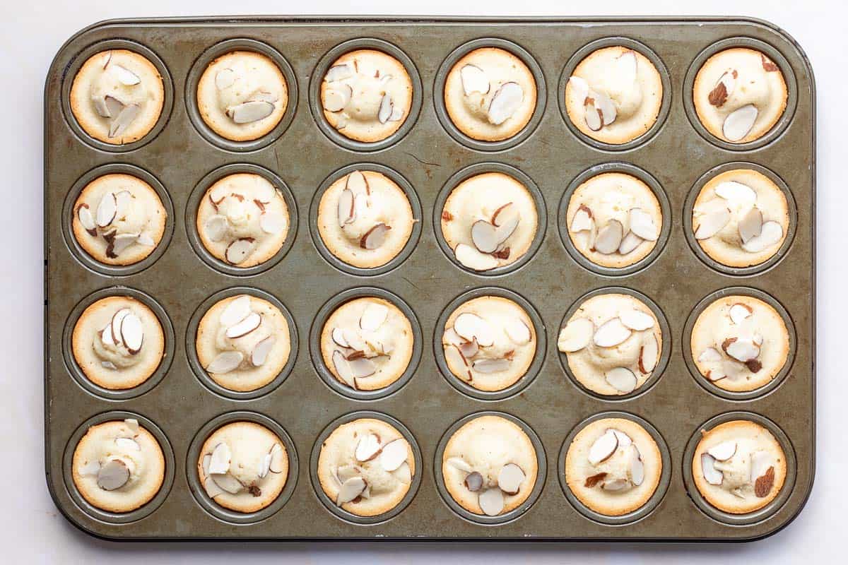 Baked financiers in muffin tin.